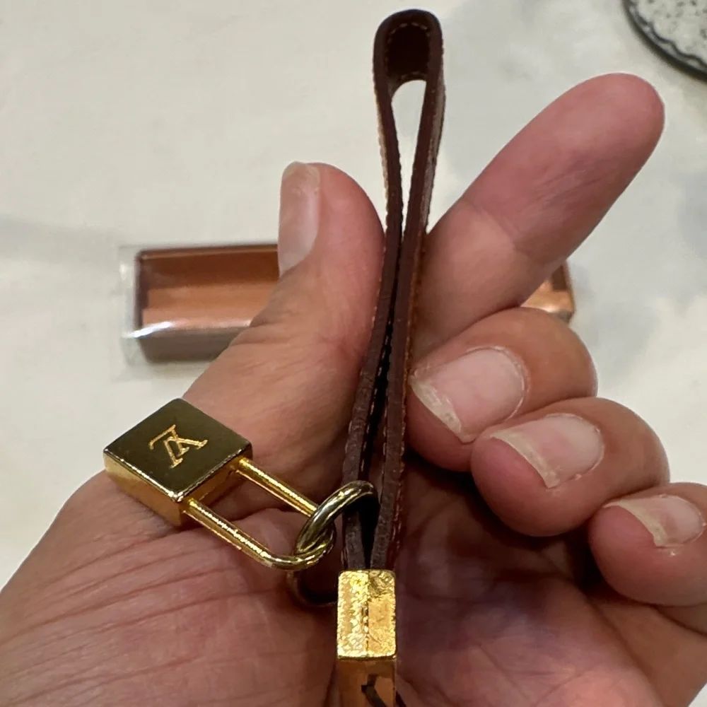 Louis Vuitton Brown Leather Key Holder with Gold Lock